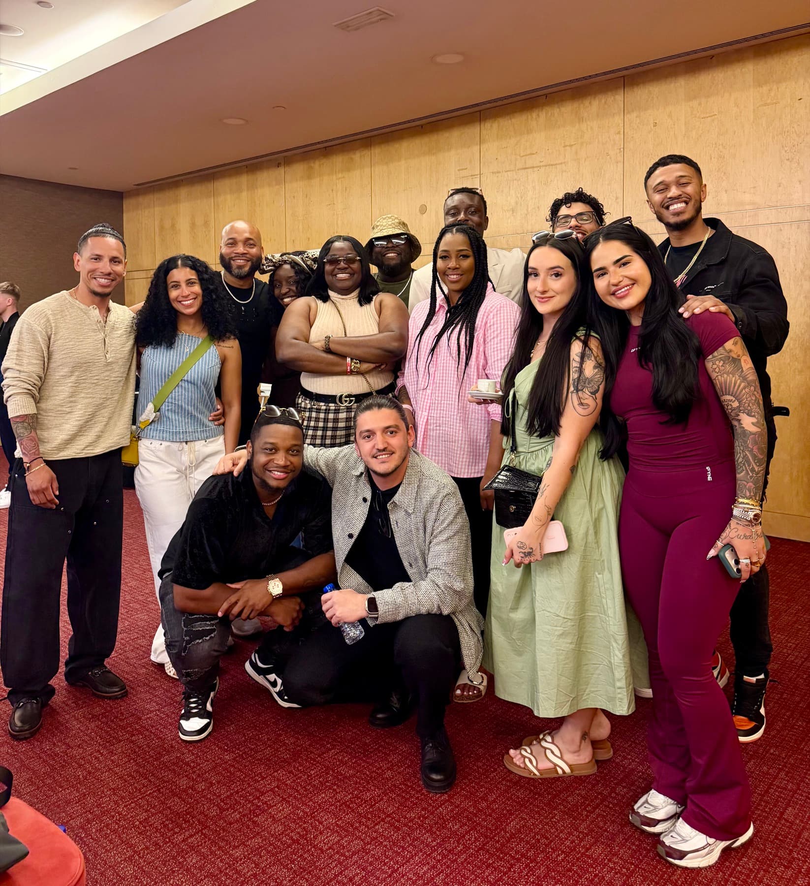 Miranda with a large group of Alpha Society members at an in-person event