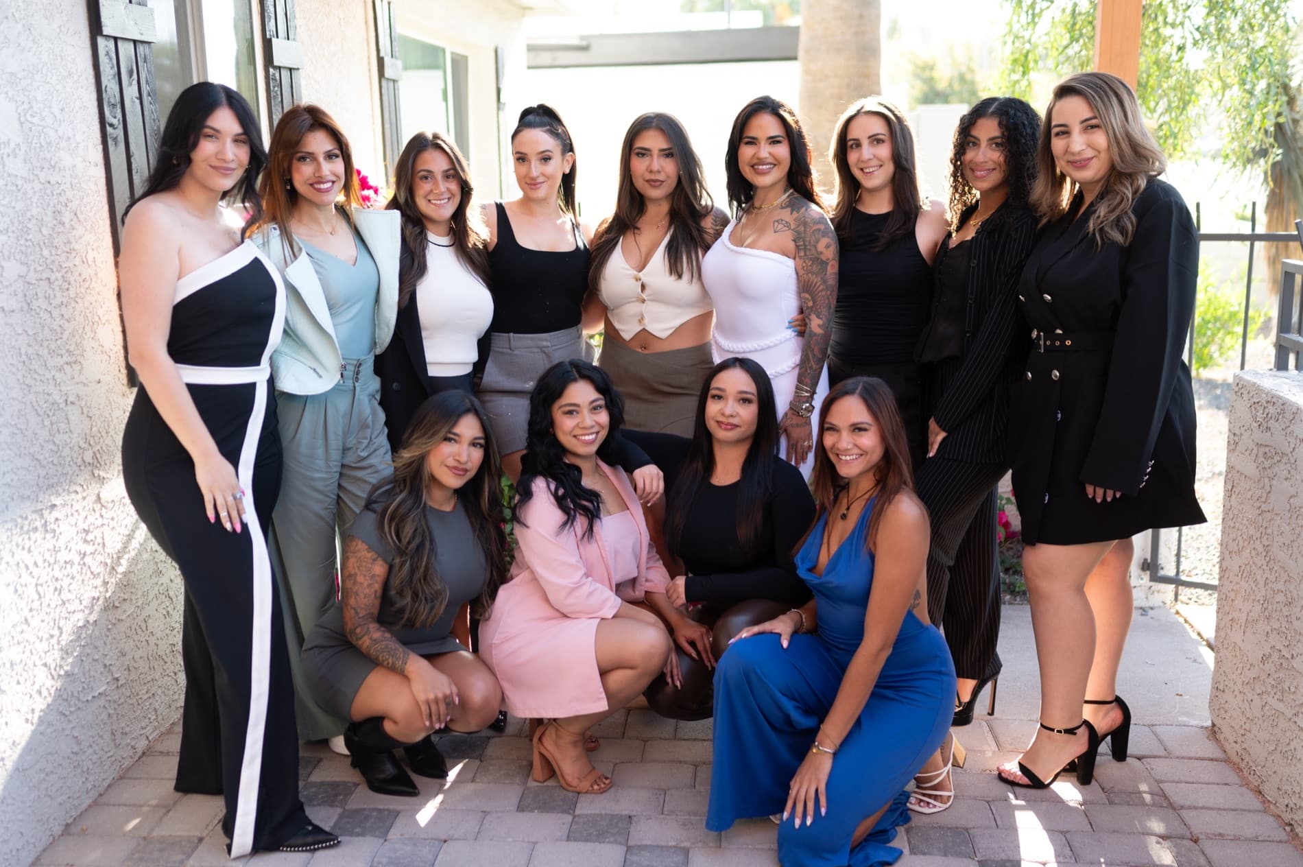 Miranda with a group of thirteen women from her community at an outdoor event